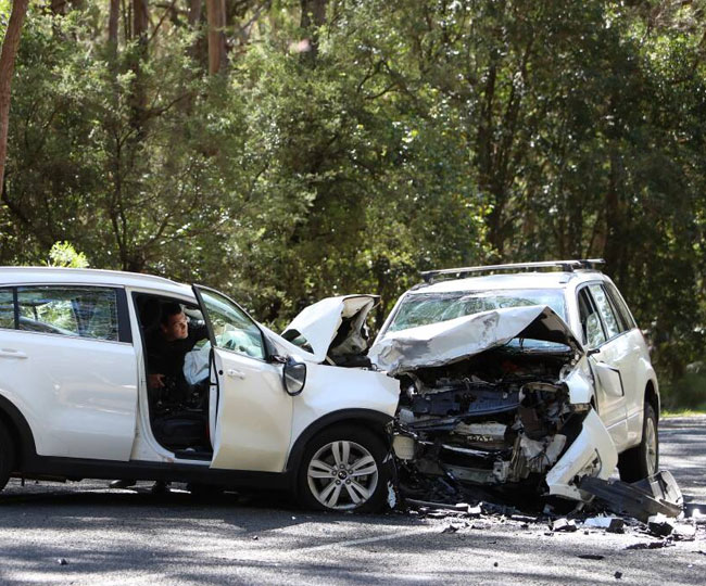 A white car with visible crash damage, relevant to Cash for Accident Cars in Brisbane.
