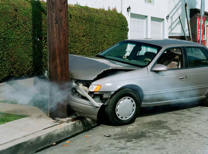 A vehicle impacted by a pole, illustrating the urgency of Same Day Accident Car Removal in Brisbane.
