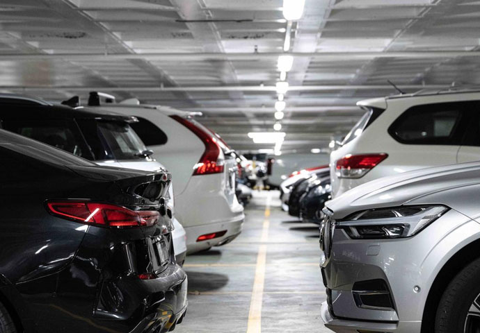 A large parking garage filled with cars, reflecting the idea of Top Cash for Unregistered Cars in Brisbane.